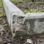 Przyczyny degradacji i pękania betonowych obrzeży ogrodowych w kontakcie z gruntem
